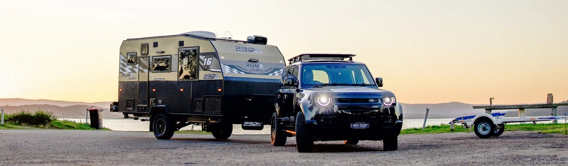 Car and caravan parked in an empty carpark for a low-speed brake gain test stop