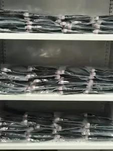 Bagged Elecbrakes wiring looms stacked on shelves in the factory
