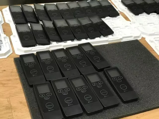 Rows of Elecbrakes in-car remotes laid out on the assembly bench