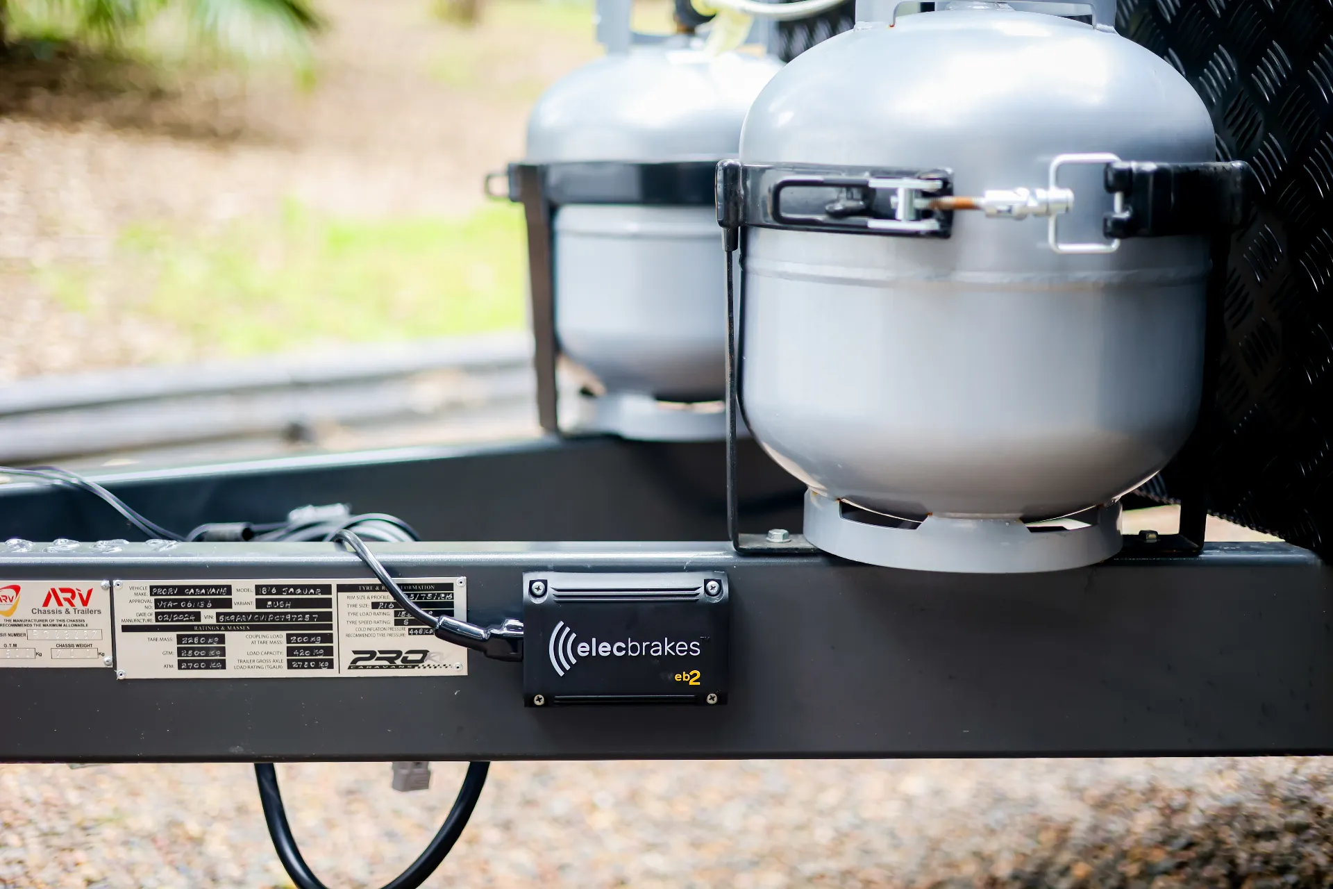 Elecbrakes eb2 unit mounted on trailer, with gas tanks in the background.